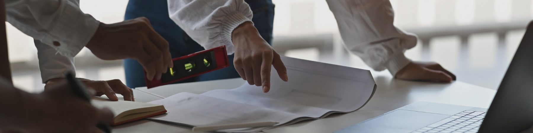 People gathered around a table working on a project