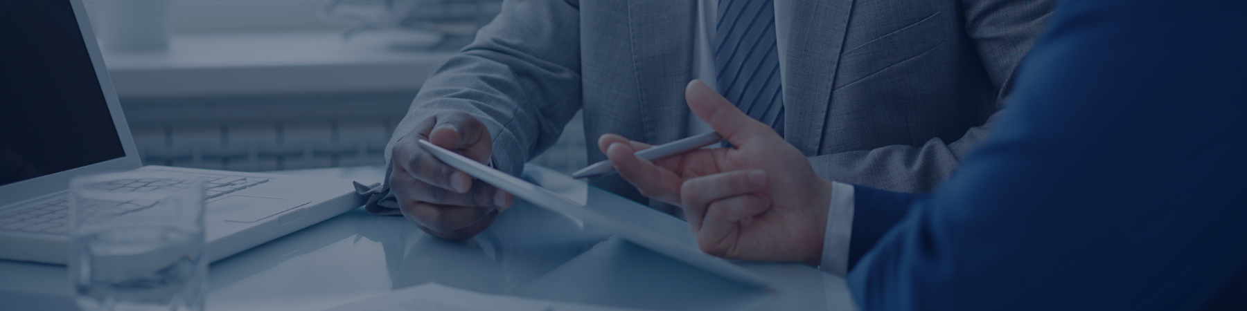 Two people conversing over a report