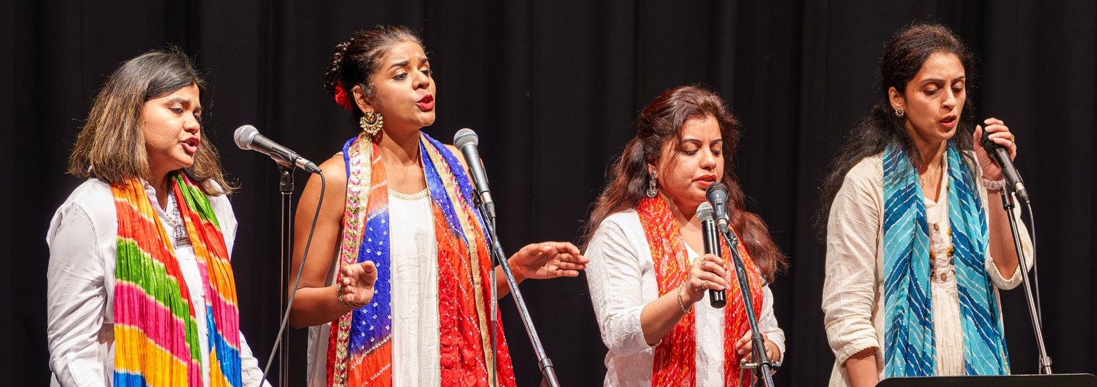 A row of woman singing