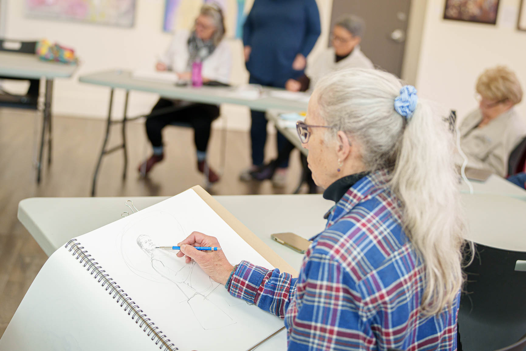 A group of woman sketching