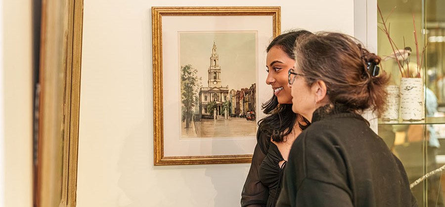two women looking at art
