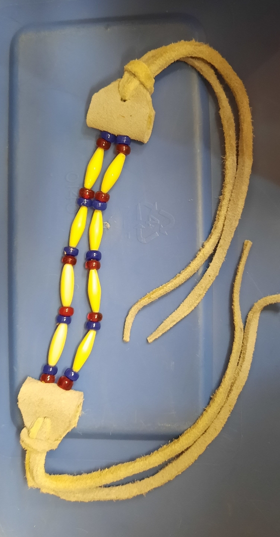 Yellow Beads leather. Picture of a  2-row bracelet using beads and leather.