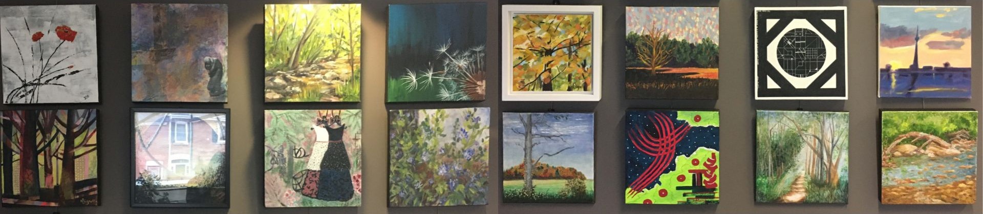 Square paintings displayed on a wall