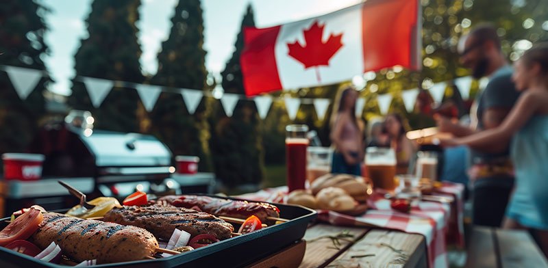 Family playing in the snowCanada Day BBQ with nation's flag in the forefront